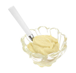 Vanilla pudding in bowl with spoon