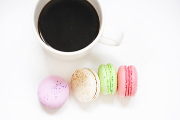 Coffee and macaroons on table