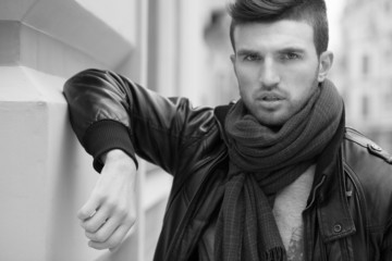 Fototapeta premium Black and white portrait of fashionable man on the street