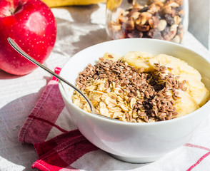 oatmeal with banana and flax seeds, apples, a healthy breakfast