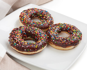 Donuts with chocolate on a plate