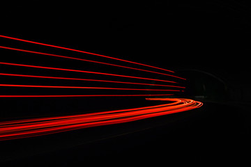 Car light trails in the tunnel.