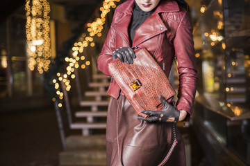 Woman with expensive crocodile leather handbag - 80750299