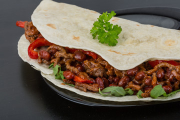 Burrito with minced meat and beans