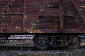 Fototapeta na wymiar Old steam engine train wheels and parts close-up