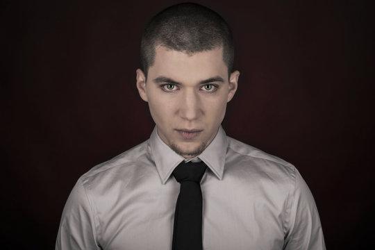 Young man with white skin in shirt and tie
