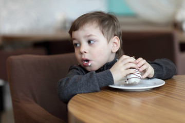 Boy has eclair