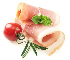 Sliced prosciutto with rosemary on white background