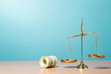 Money. Law scales and cash money on table concept photo