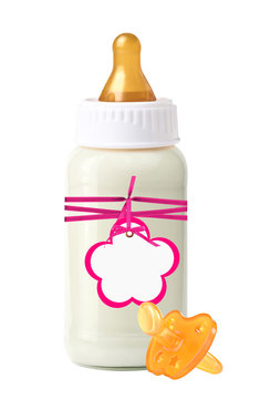 baby milk bottle with pink tag and dummy isolated on white