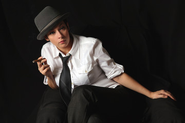the girl keeps in fingers a cigar