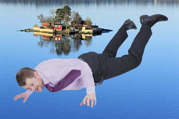 Businessman falling down and sea island in background