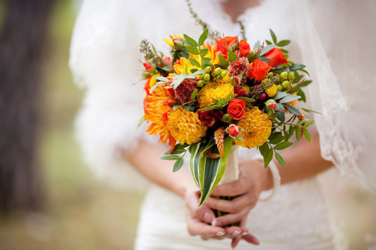 Orange Wedding Bouquet In Hands