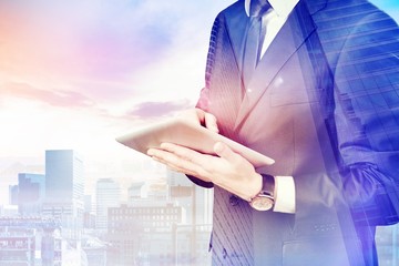 Concept. Double exposure of city and businessman using digital