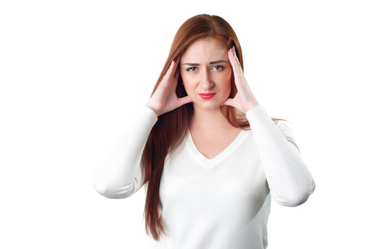 Young redhead woman with headache