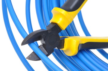 Tool pliers cutting blue cable isolated on white background
