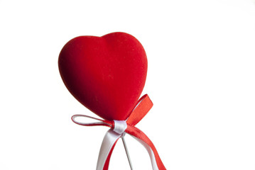 Heart shaped decoration with a bow on a stick