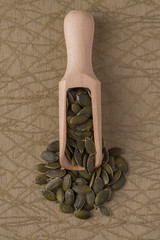 Wooden scoop with pumpkin seeds