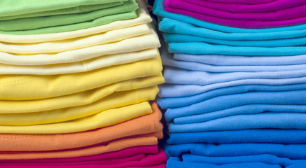 Pile of bright folded t-shirts