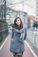 Fototapeta premium Beautiful girl posing in an urban context