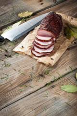 Smoked ham on a chopping board.