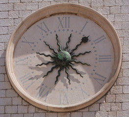 Fototapeta na wymiar Vintage moon clock on the white brick wall.