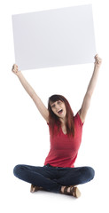 Happy Girl Sitting on the Floor Raising Cardboard
