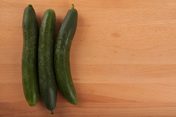 Cucumbers on wooden table