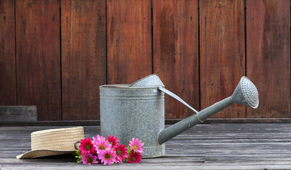 Metal watering pot set with flower and hat