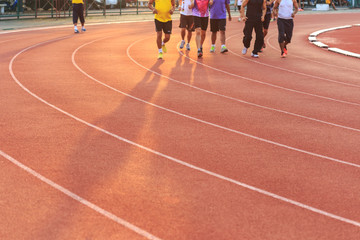 Fototapeta premium Running track with blur of runner feet in stadium