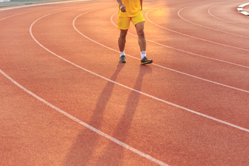 Fototapeta premium Running track with blur of runner feet in stadium