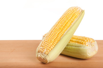 Sweetcorn on wooden table