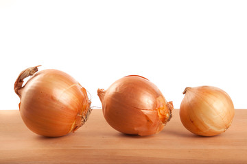 Onions on wooden table