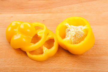 Cut yellow bell pepper on cutting board