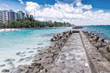 Fototapeta premium MALE', MALDIVES - MARCH 7, 2015: Locals and tourists relax on ci