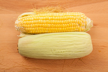 Sweetcorn on wooden table