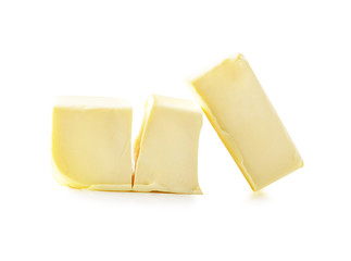 Stick of butter, cut, isolated on white.