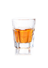 Whiskey in a shot glass isolated on a white background
