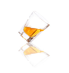 Whiskey in a shot glass isolated on a white background