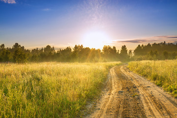 the rural landscape with sunrise  and the road