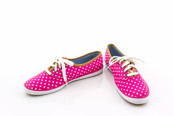 Pink polka dot canvas shoe.
