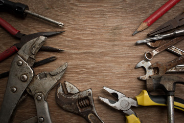 Old tools renovation on grunge wood.