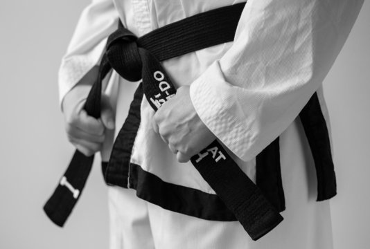 Taekwondo woman with her black belt.