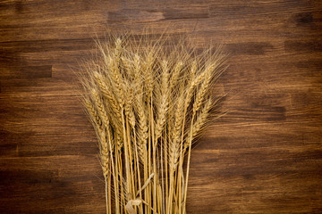 wheat on wooden background.