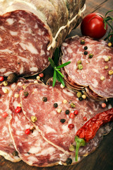 Obraz premium delicacy smoked sausage (salami) on a wooden board