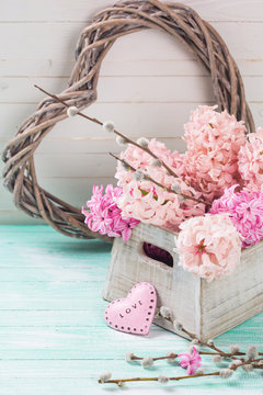 Fresh flowers hyacinths in box and decorative heart