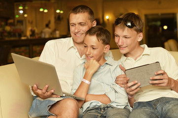 Family sitting with laptop