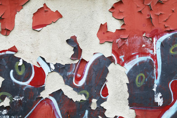 Grungy wall background texture with graffiti fragments