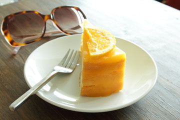 Orange Cake with orange topping in dish on the table