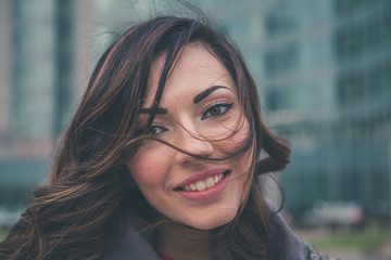 Beautiful girl posing in an urban context